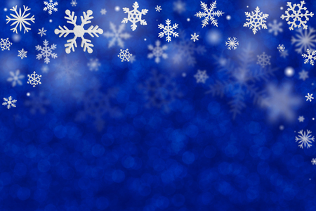Christmas decoration with snowflakes on defocused blue background.の写真素材