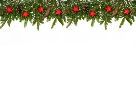 Christmas long decoration  with red stars, cones and silver ribbons on artificial snow. White background.の写真素材