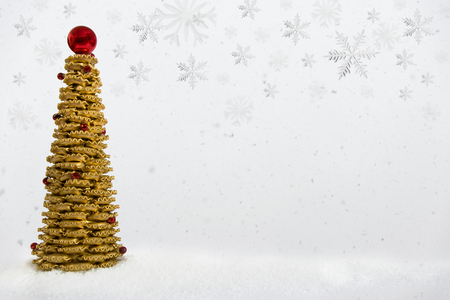 Noodle christmas tree on artificial snow flakes. Falling down snow.の写真素材