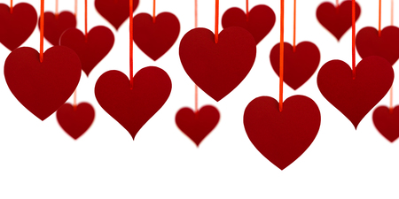 Valentine's day upper decoration with hanging hearts on white background.の写真素材