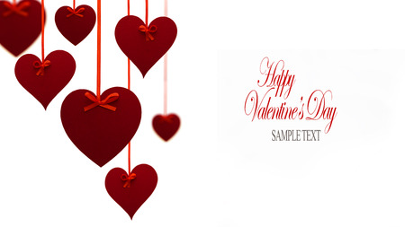 Valentine's day left side decoration with hanging hearts on white background.の写真素材