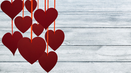 Red hearts on gray planks. Valentine's Day background.の写真素材