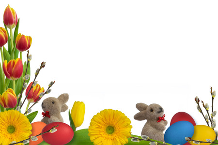 easter decoration with rabbits, eggs, flowers and catkins on white backgroundの写真素材