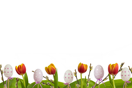 Easter lower decoration  with  eggs, red tulips and catkins on white background.の写真素材