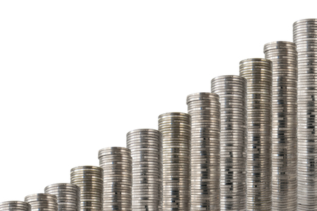 Rows of coin stacks isolated on white. Slanted  decoration with money.の写真素材