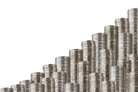 Rows of coin stacks isolated on white. Slanted  decoration with money.の写真素材