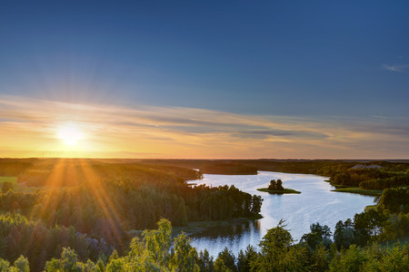 Sun sets over beautiful Jedzelewo Lake. Stare juchy, Poland.の写真素材