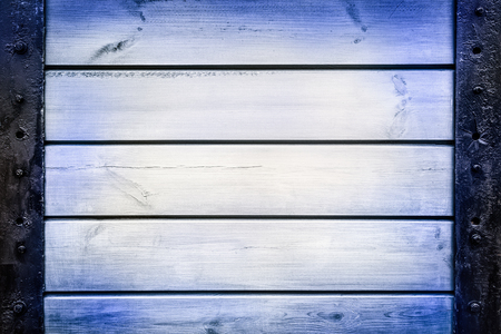 Boards screwed to steel plates. Metal and wood texture.の写真素材