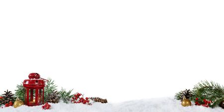Christmas panoramic decoration with lantern, cones and rrowanberries isolated on white background.の写真素材