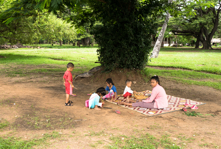 Mother and her children in a parkのeditorial素材