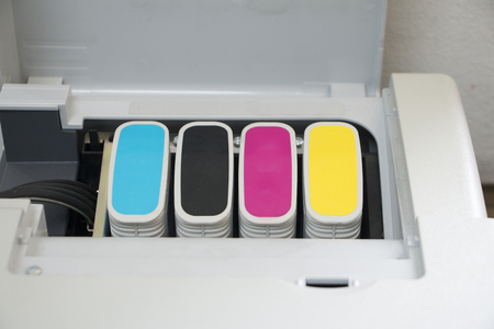 Detail of computer printer ink cartridges with separate units in carrierの写真素材