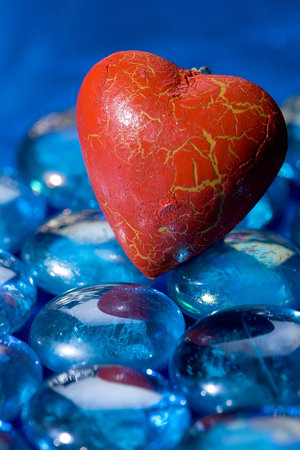 The red heart on the blue crystalsの写真素材