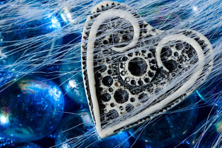 White ivory heart shape on blue crystalsの写真素材