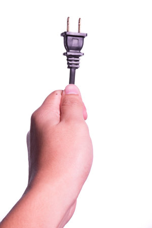 Hand with plug in isolated background.