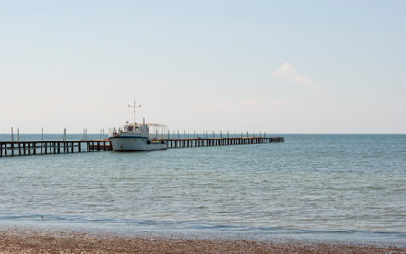 Photo seascape with a pier and a ship. Kherson region, the town of Skadovsk.の写真素材