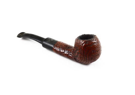 brown old tobacco pipe on white backgroundの写真素材