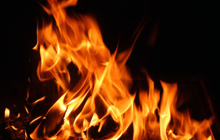 flames of a fire in the dark