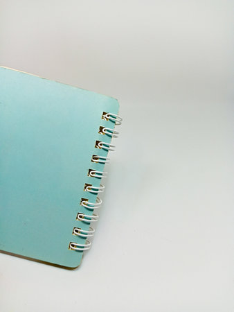 Notebook on the white background, close-up, soft focus