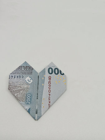 indonesian rupiah origami heart shaped