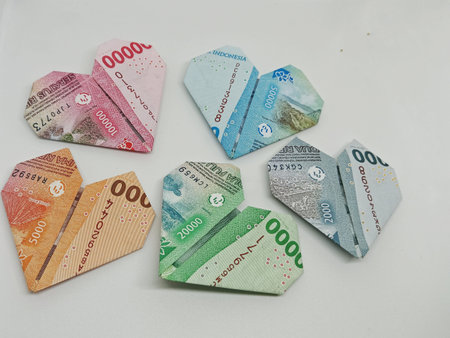 Origami Indonesia banknotes of different denominations in different colors on a white background