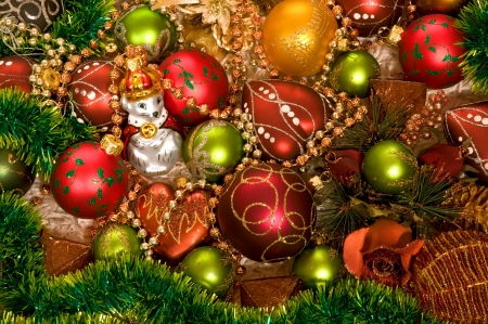 Chrismas-tree decorations on white carpet with tinselの写真素材