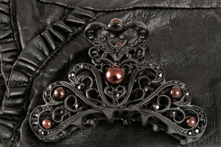 Bobby pin on a black leatherの写真素材