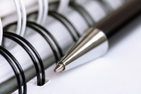 Ball pen and office pad (manual focus on the pen tipの写真素材