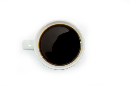 Top view of a cup of coffee on white background.の写真素材