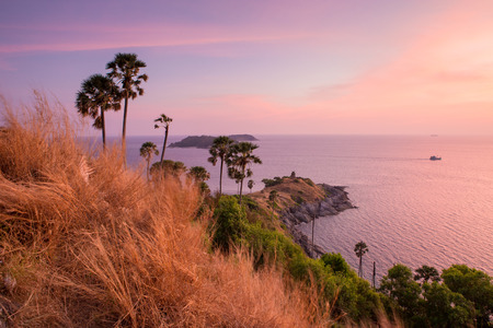 Promthep Cape is a mountain of rock that extends into the sea in Phuket, Thailandの写真素材