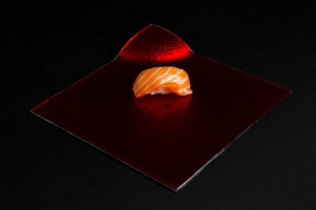 Asian cuisine dish, delicious sushi, sushi on a black background, roll you net on a black background,の写真素材