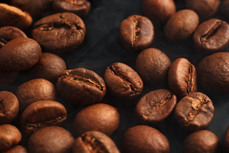 Coffee beans on a black background. Coffee on a black background with reflection.