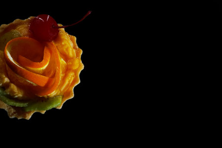 Delicious cake with cherries, kiwi and oranges.の写真素材