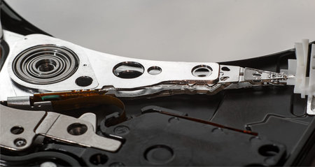A close-up of a hard drive head from a computer.