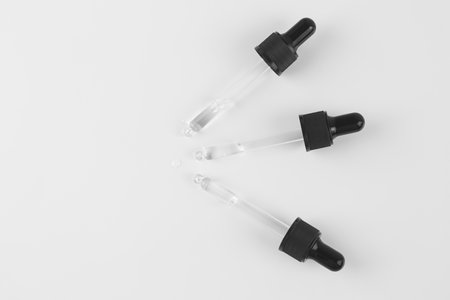 Pipettes with liquid on a white background.の写真素材