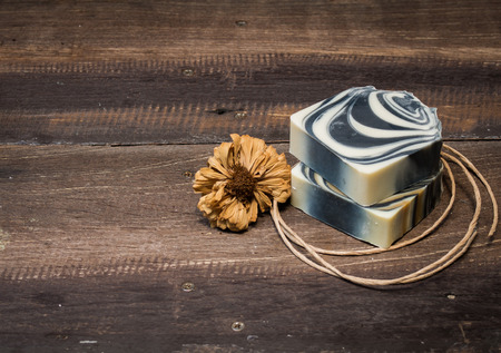 Natural soap bars on old wooden backgroundの写真素材