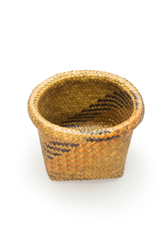 Empty wicker basket isolated on white backgroundの写真素材