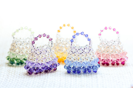 Fashionable handbag with crystal and pearl jewelry.の写真素材