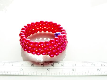 Multi-colored bracelets with beads. Colourful child's bead bracelet.の写真素材