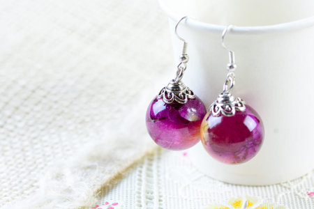 Dried rose in crystal clear resin pendant necklace, pendant with a real rose.の写真素材