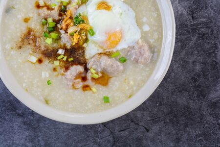 Congee, Rice porridge with minced pork, boiled egg, great for breakfast.の写真素材