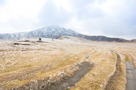 Mount Aso and Kusasenri in winter. covered by golden yellow grassland - Kumamoto, Japanの写真素材