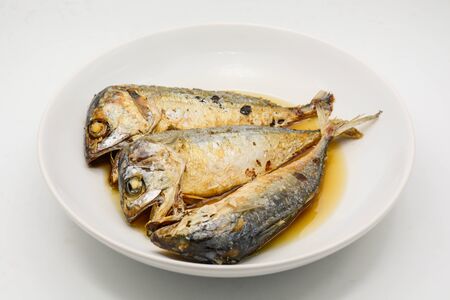 Fried mackerel on white plate. Deep fried fishの写真素材
