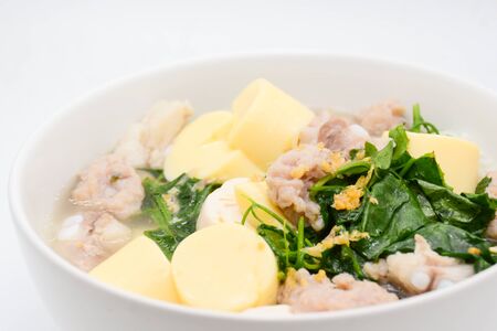 Boiled rice with pork, ivy gourd leaves and soft tofuの写真素材
