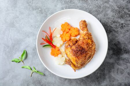 Hot and spicy baked chicken on white plate
の写真素材