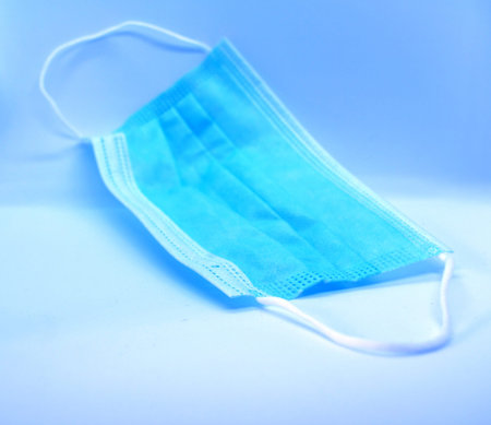 medical mask. The photo shows a blue medical mask.