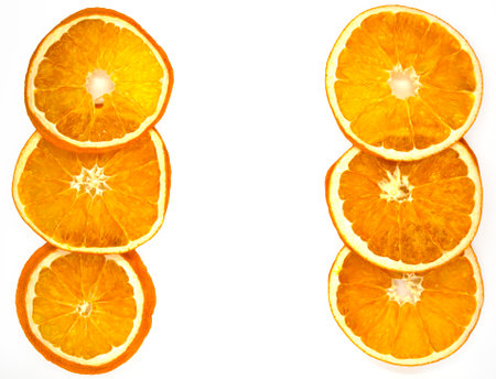 Dried orange slices, background. Dried orange slices on a white background, close-up.の写真素材