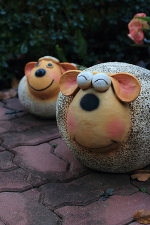 The smiling sheep on the floor. It's for garden decorate.の写真素材