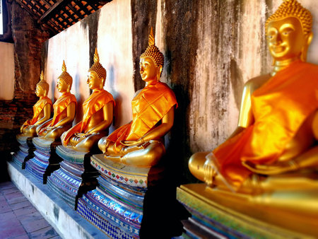 The Buddha statues are arranged beatifully at temple. The old temple has a lot of them.