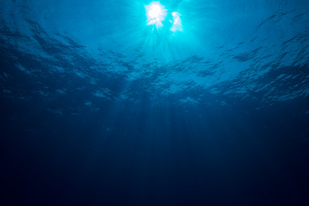 Sun with rays look from underwaterの写真素材