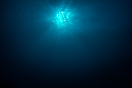 Sun with rays look from underwaterの写真素材